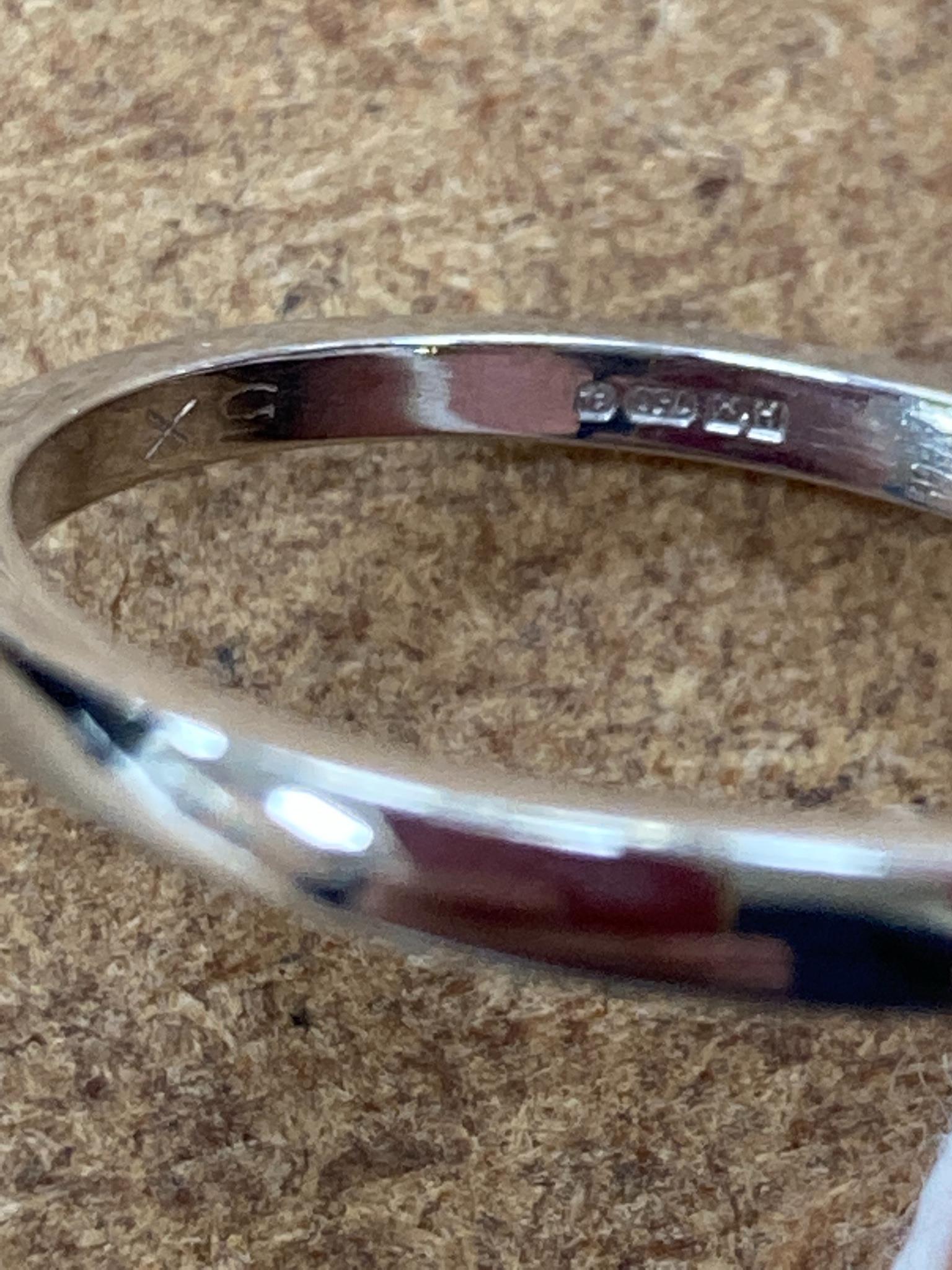 A modern 18ct white gold and solitaire oval cut diamond ring, size M, gross 3.1 grams, with GIA report dated 26/01/1999 stating the stone to weigh 0.88ct with a colour and clarity of F and SI1.